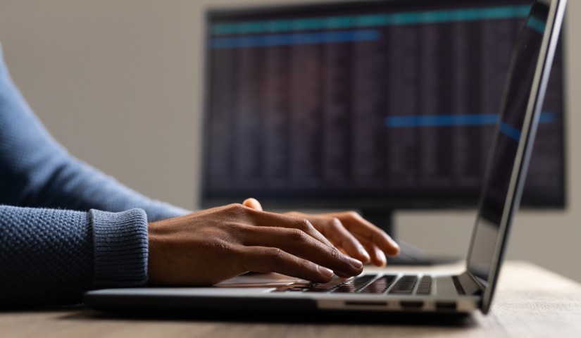 Someone typing on a computer