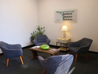 Technical Resource Solutions lobby with four chairs and a table