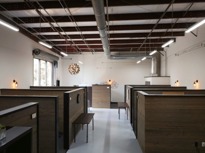 Technical Resource Solutions building with wooden desk where employees work 